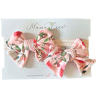 Baby headband with bow and matching bow clip in Peachy Rose Fields Classic Brushed fabric.