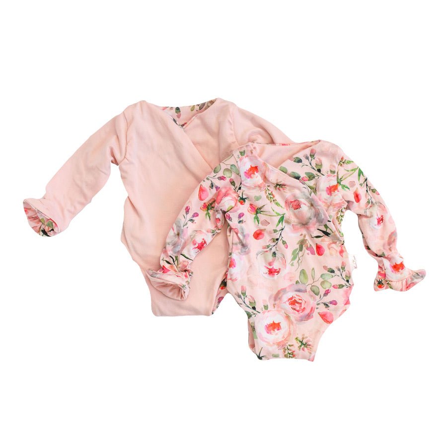 Long sleeve winged baby bodysuit featuring ruffle cuffs in soft Peachy Rose Fields design brushed fabric.