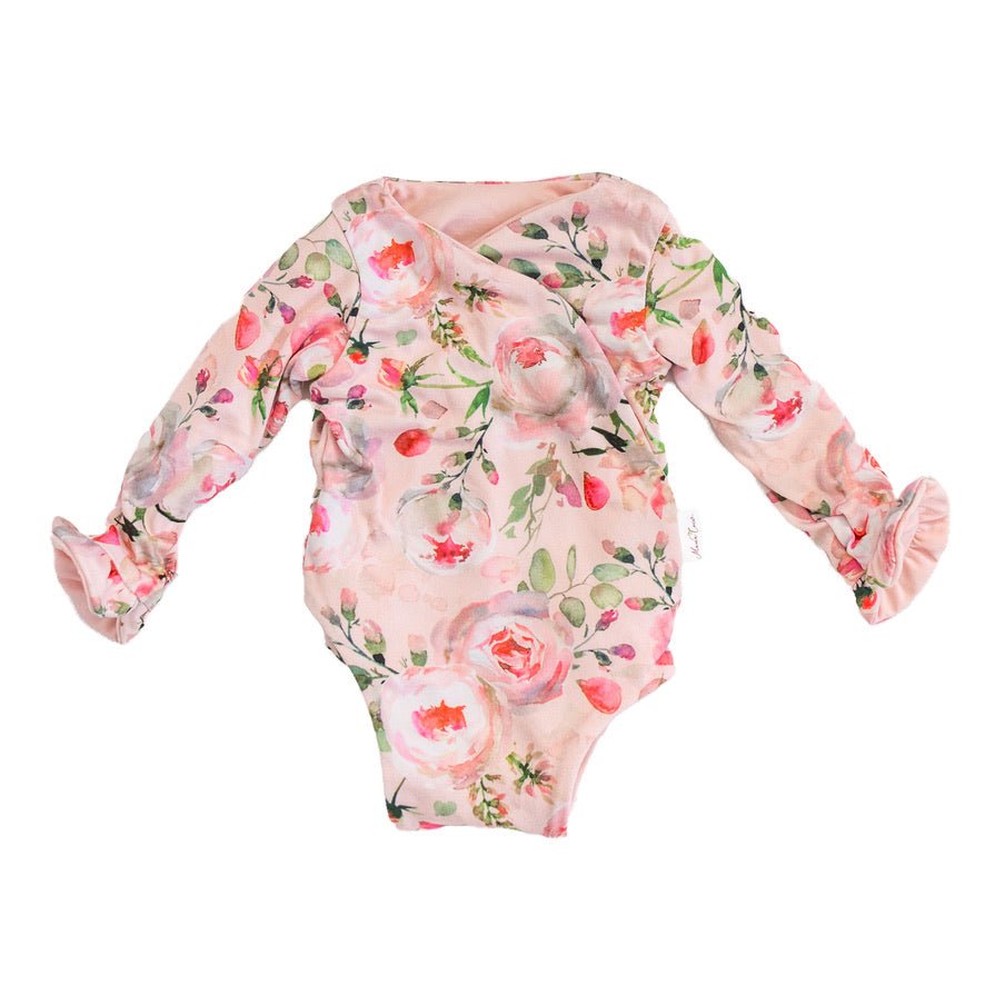 Soft Peachy Rose Fields design brushed fabric baby bodysuit with winged sleeves and elegant ruffle cuffs.
