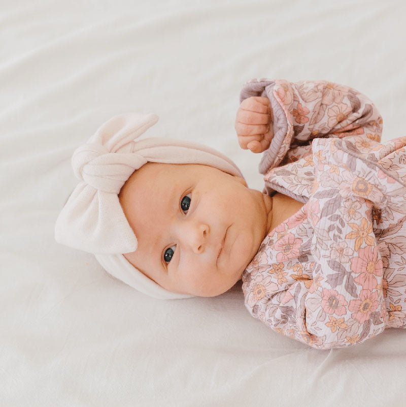 Soft and elegant baby headwrap with bow in Plush Pink Cashmere fabric.