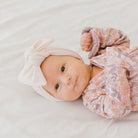Soft and elegant baby headwrap with bow in Plush Pink Cashmere fabric.