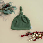 Knotty beanies crafted in soft Plush Juniper Pine fabric.