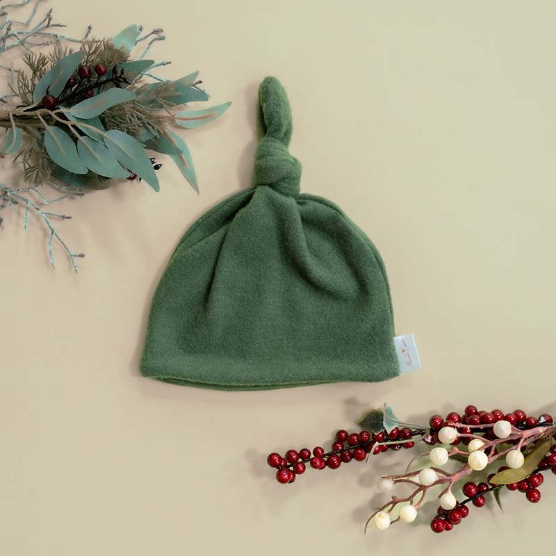 Knotty beanies crafted in soft Plush Juniper Pine fabric.