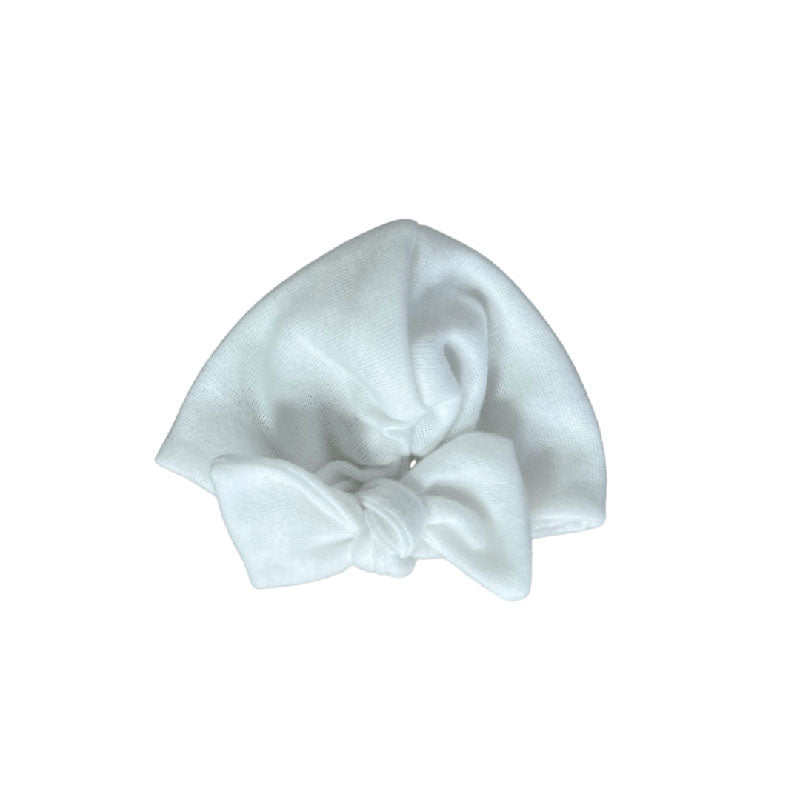 Ruched beanie with bow crafted in soft Plush Perfection design Plush Dream fabric.