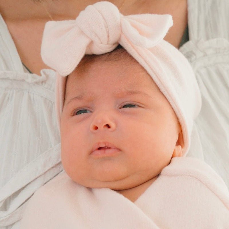 Baby headwrap with bow crafted in soft Plush Pink Cashmere fabric.