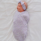 Purple Posies cocoon swaddle baby blanket in Silky Modal fabric styles with floral elegance.