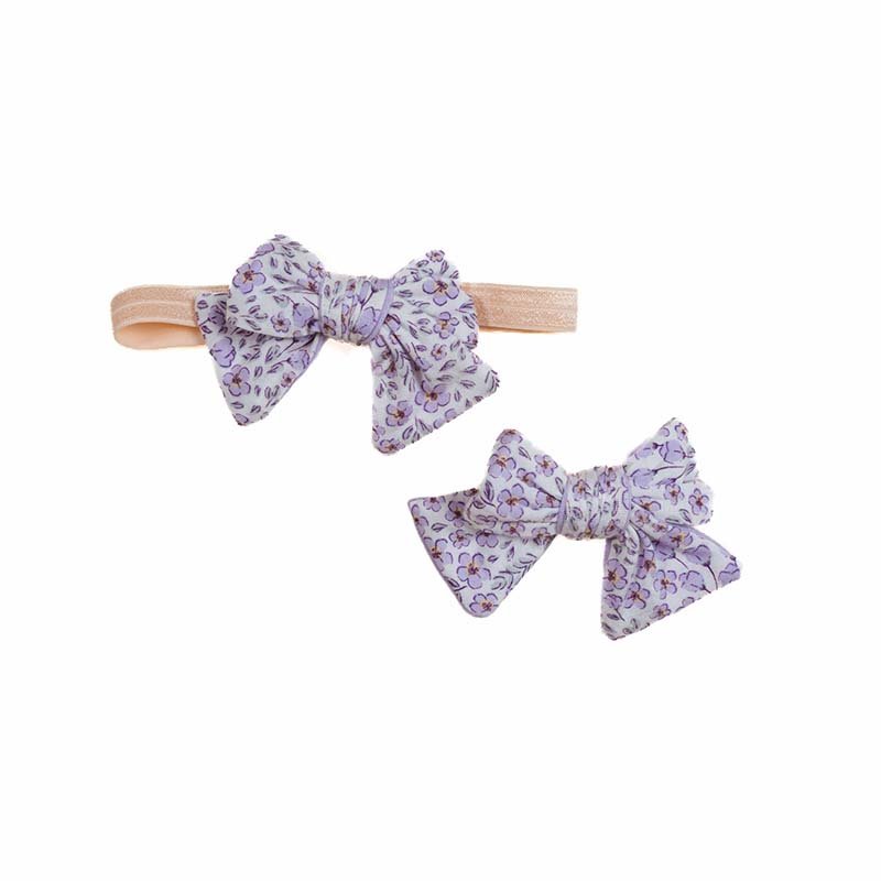 Premium Purple Posies bow headbands designed for babies.