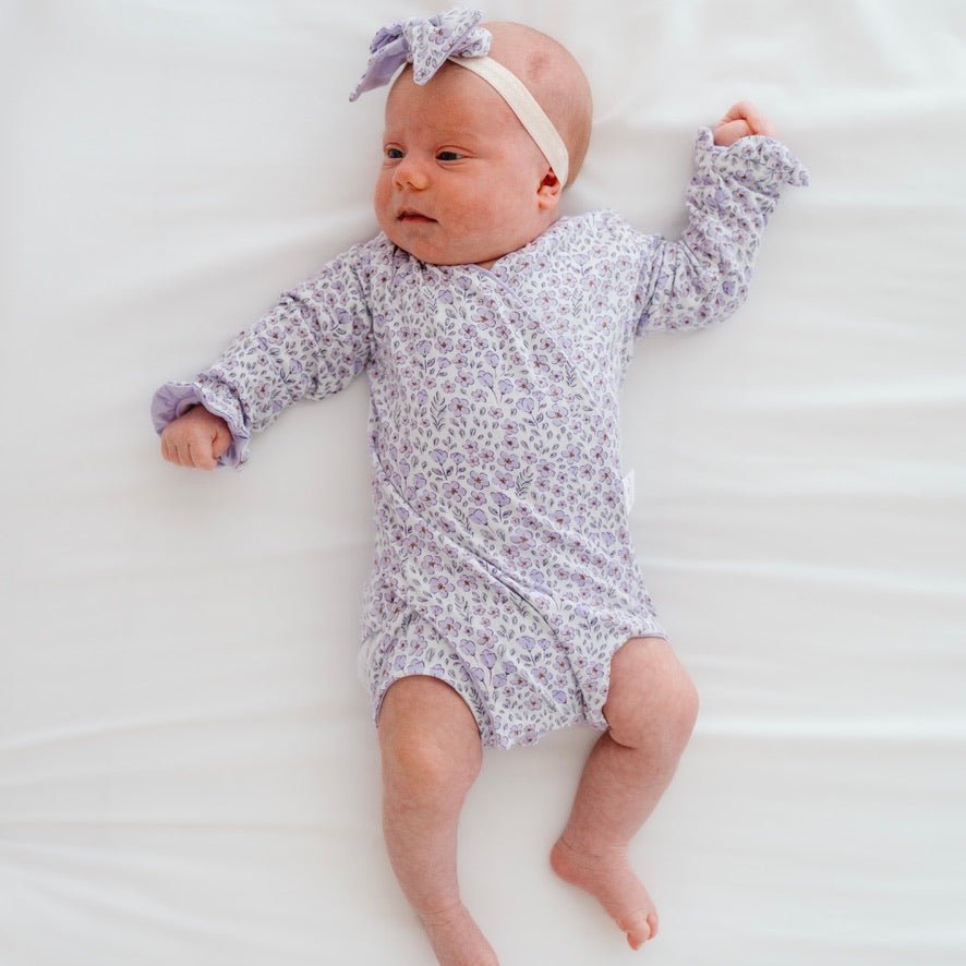 Purple posies design baby onesie outfit in silky modal fabric.