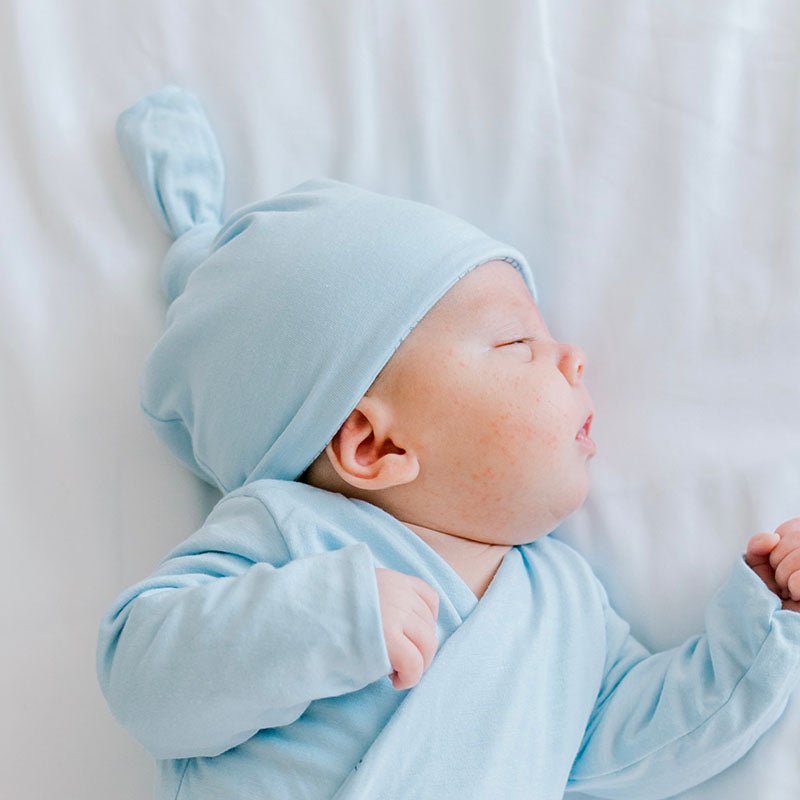 Reversible baby beanie in bon voyage design.