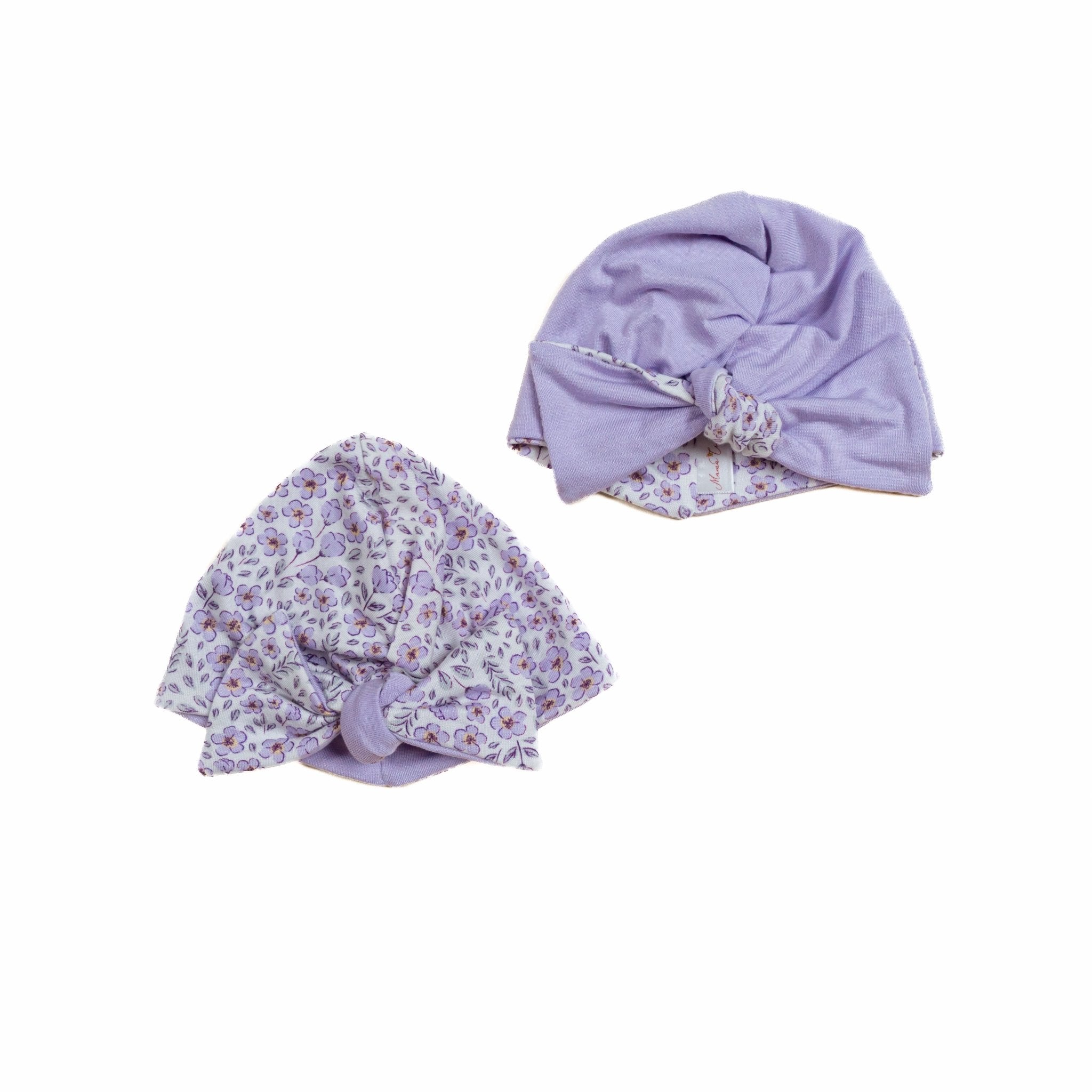 Reversible baby knotty beanie in purple posies design.
