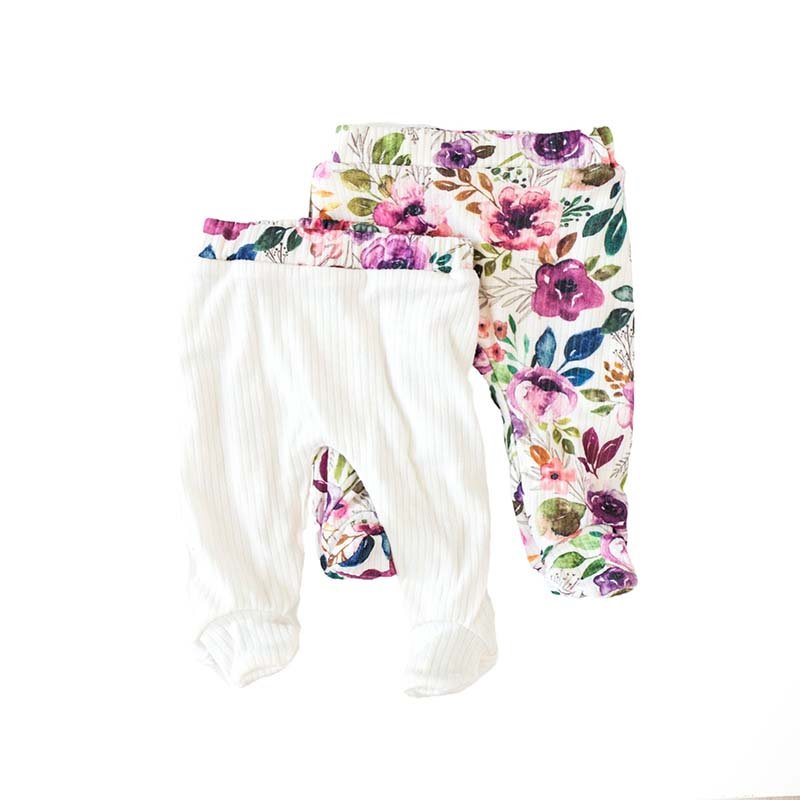 Reversible footie pants in ivory wildflowers design.