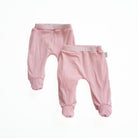 Reversible baby footie pants in pink gingham design.