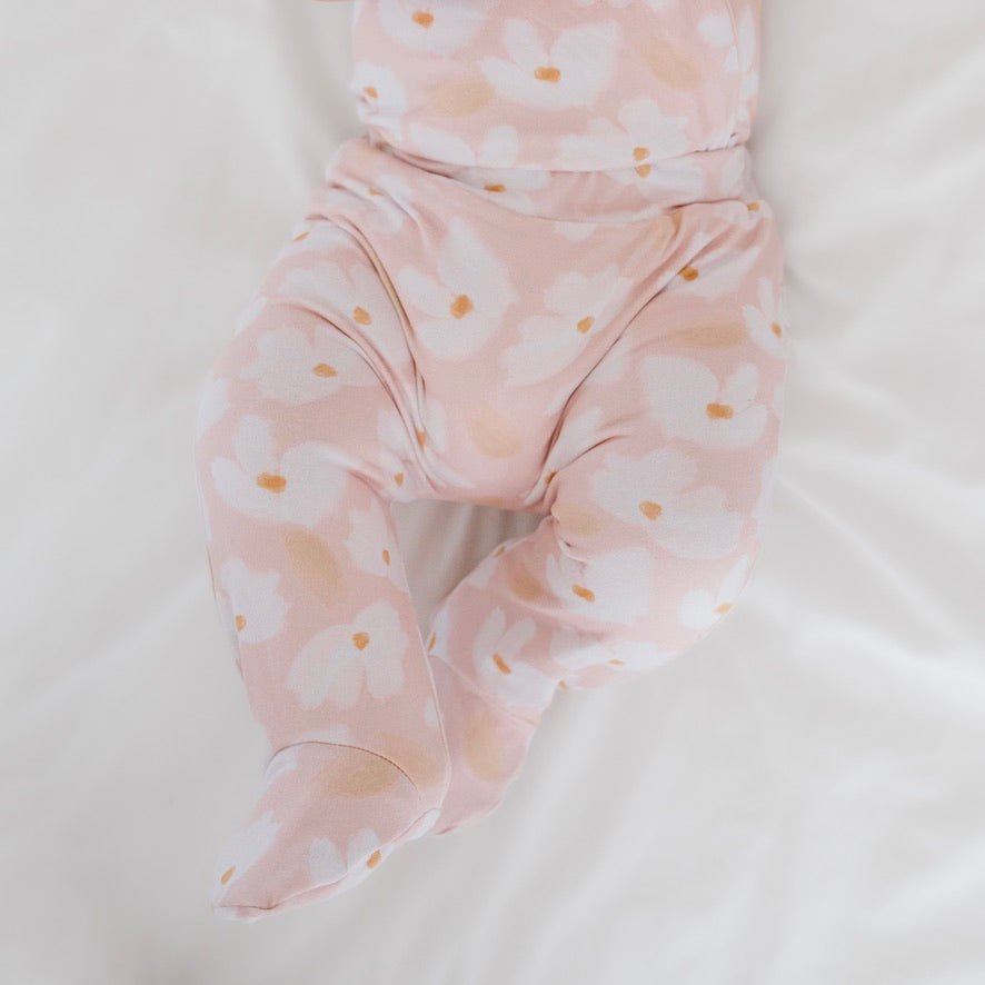 Reversible footie pants in sweet lily design.