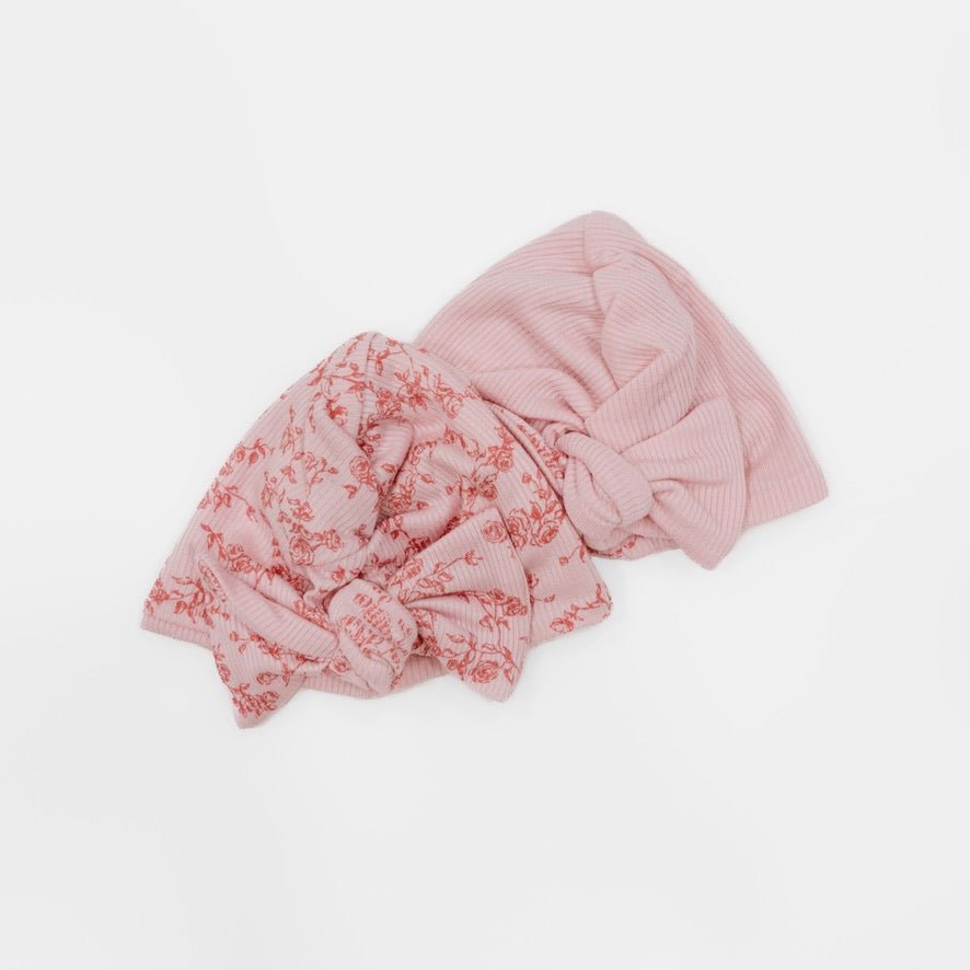 Reversible bitty pink blooms design baby knotty beanie.