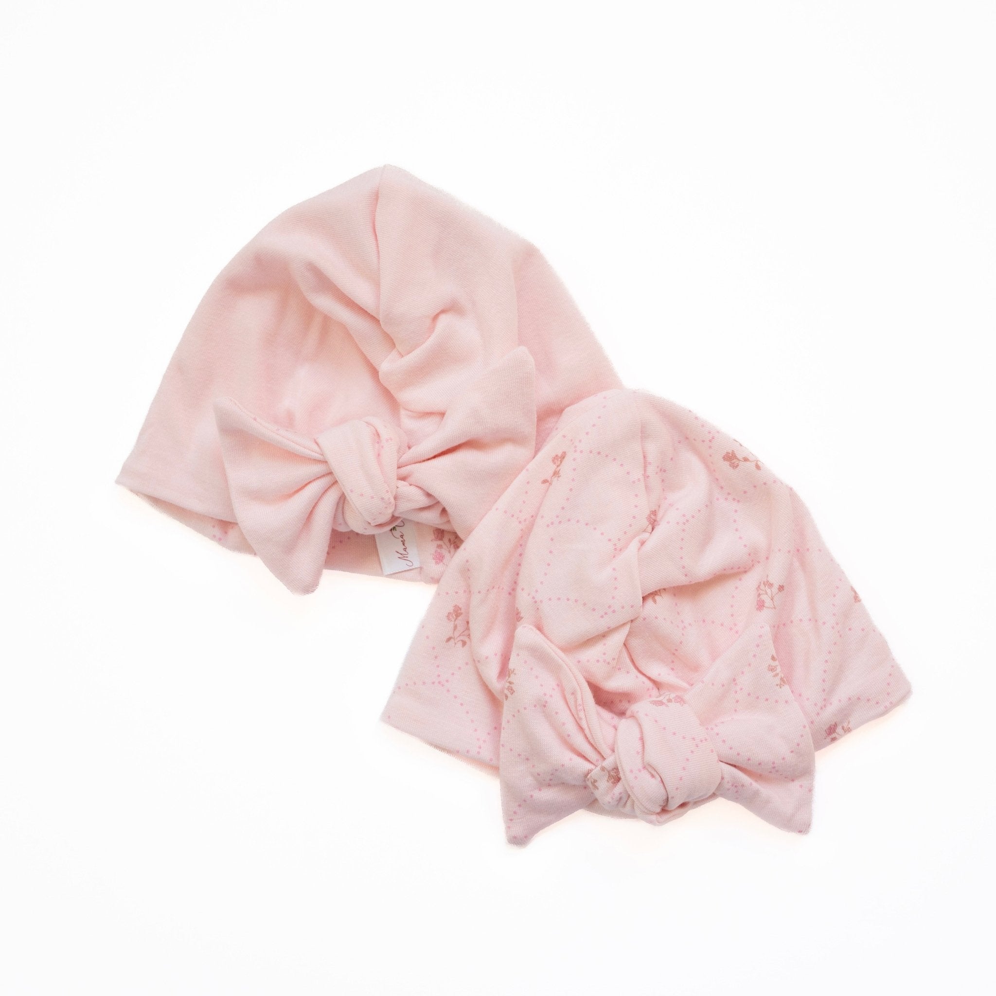 Reversible baby knotty beanie in dainty dots design.