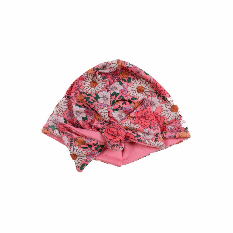 Reversible flower power design baby knotty beanie.