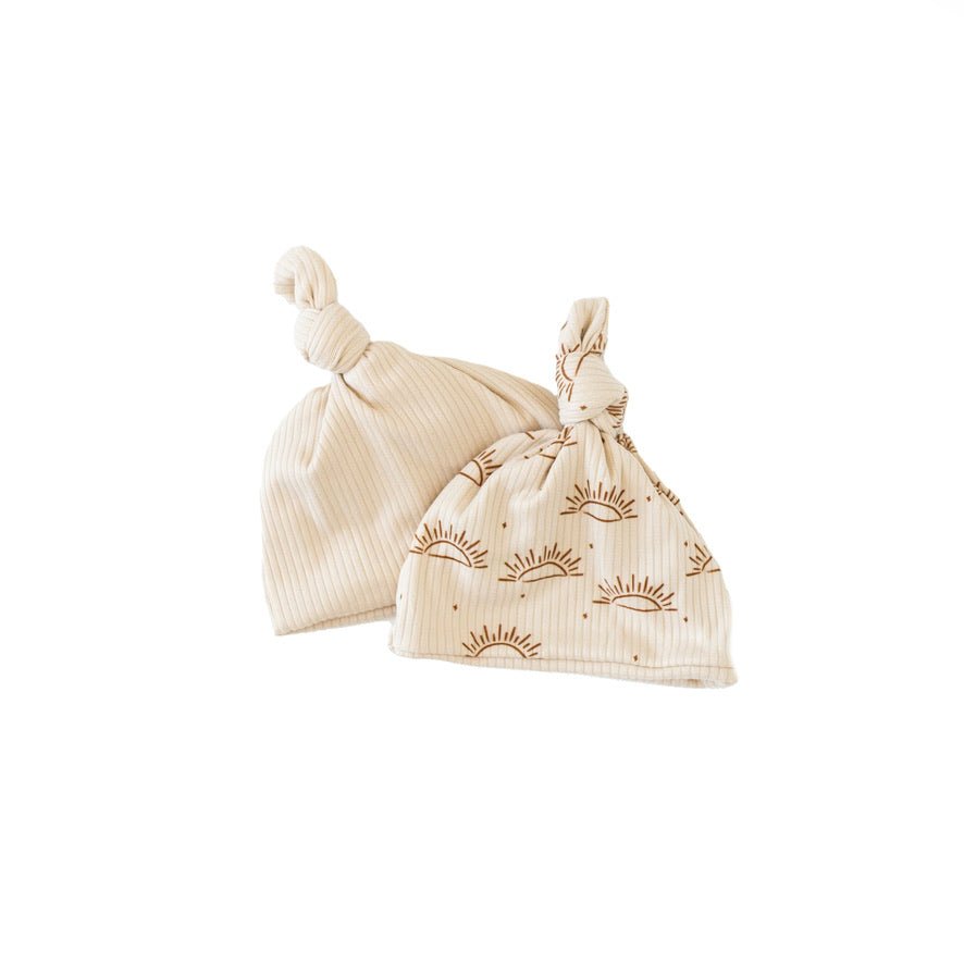 Reversible classic brushed baby beanie in sandy sunsets design.