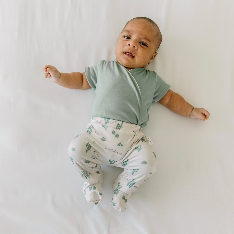 Short-sleeve reversible onesie outfit bundle in desert sunsets design.