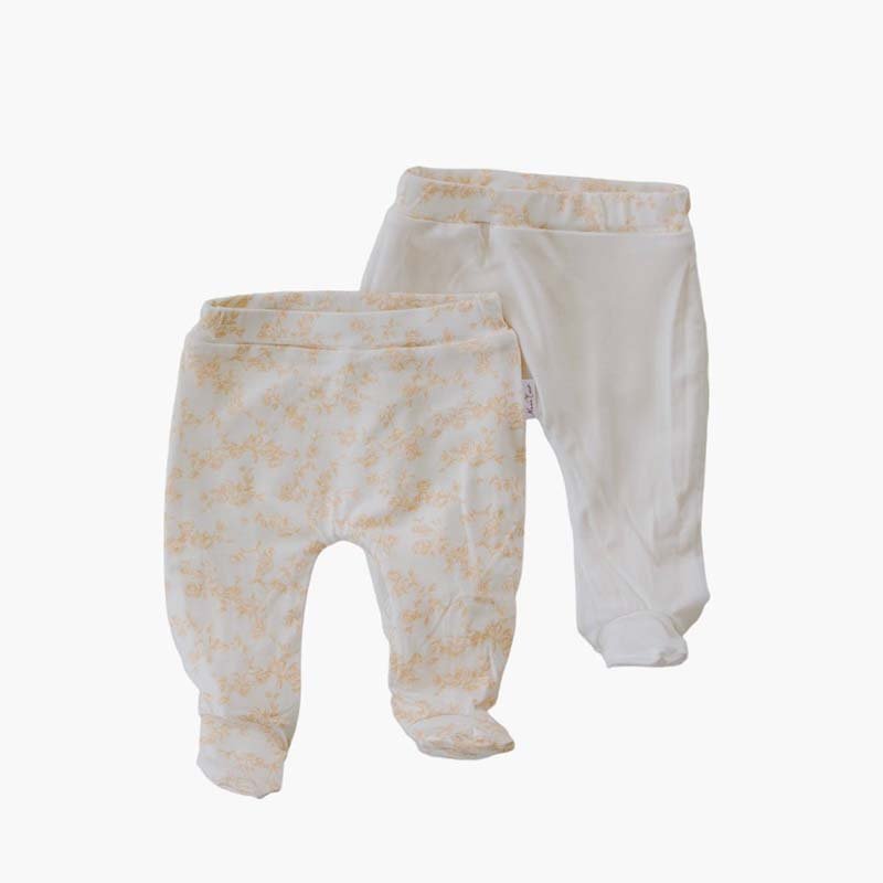 Reversible baby footie pants designed in ultra-soft bamboo organic cotton with the Bitty Blooms theme.