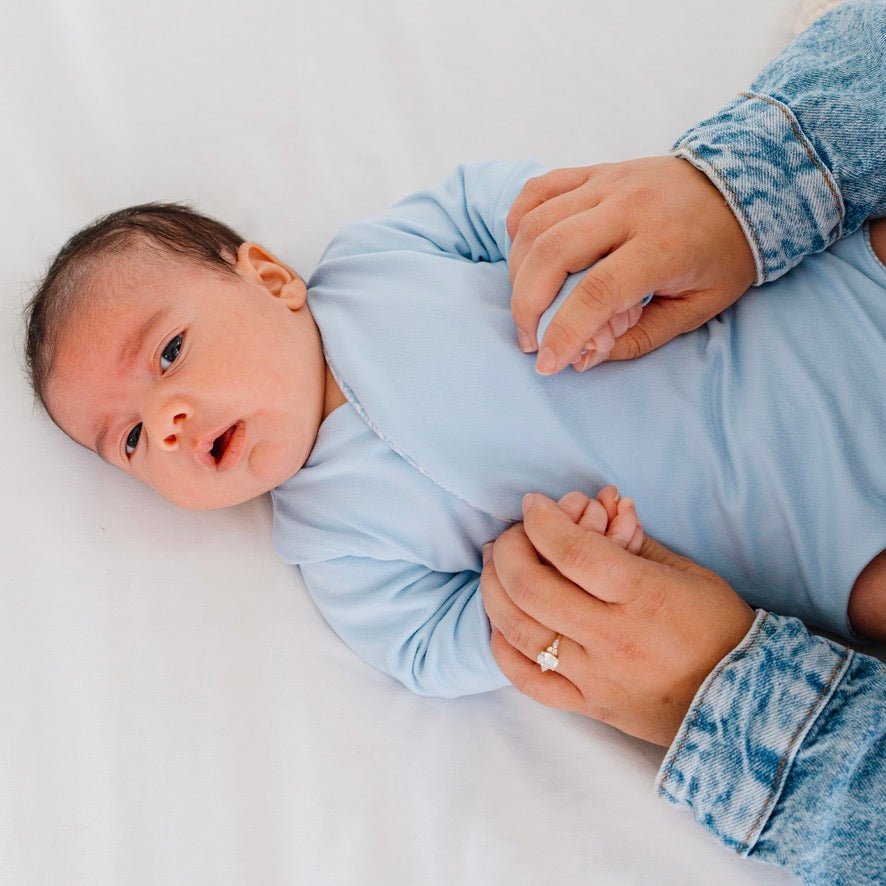 Reversible Blue Swells design long sleeved winged bodysuit in classic brushed fabric.