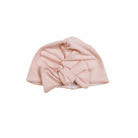 Stretchy ruched baby beanie with bow in soft Dusty Roses classic brushed fabric. Beanie is reversible.