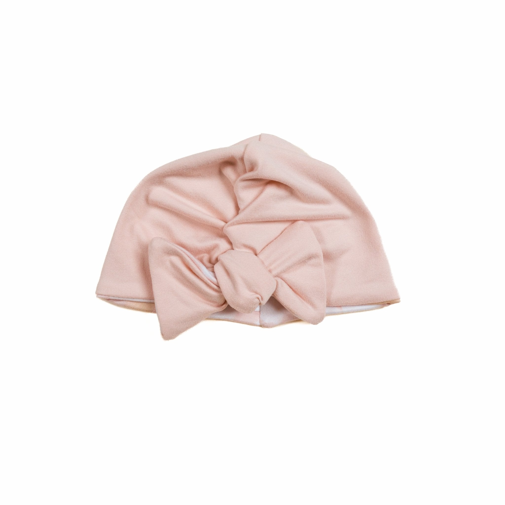 Stretchy ruched baby beanie with bow in soft Dusty Roses classic brushed fabric. Beanie is reversible.