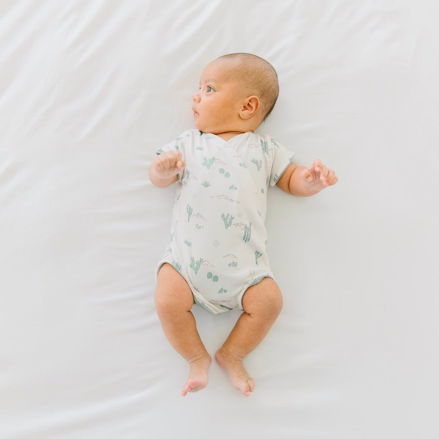 Reversible desert sunsets design cocoon baby swaddle in classic brushed fabric.