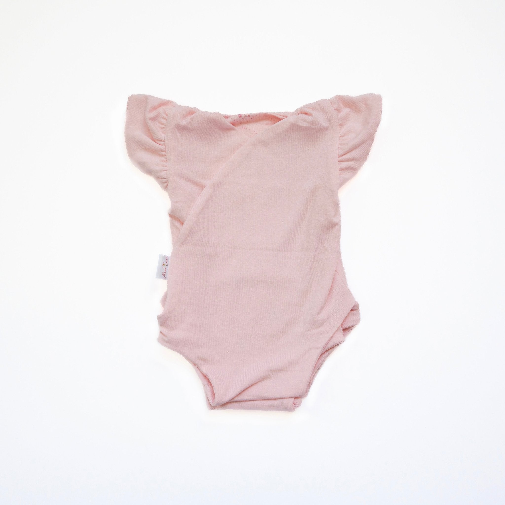 Reversible flutter sleeve winged bodysuit for babies in dainty dots design.