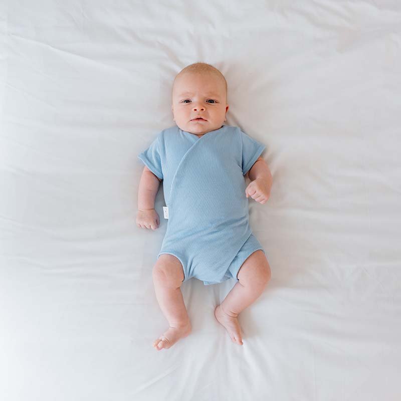 Reversible Dotted Blues design short sleeved winged bodysuit in silky modal fabric.