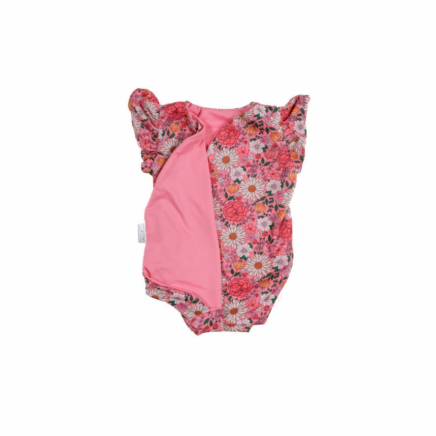 Reversible flower power design flutter sleeve baby onesie in classic brushed fabric.