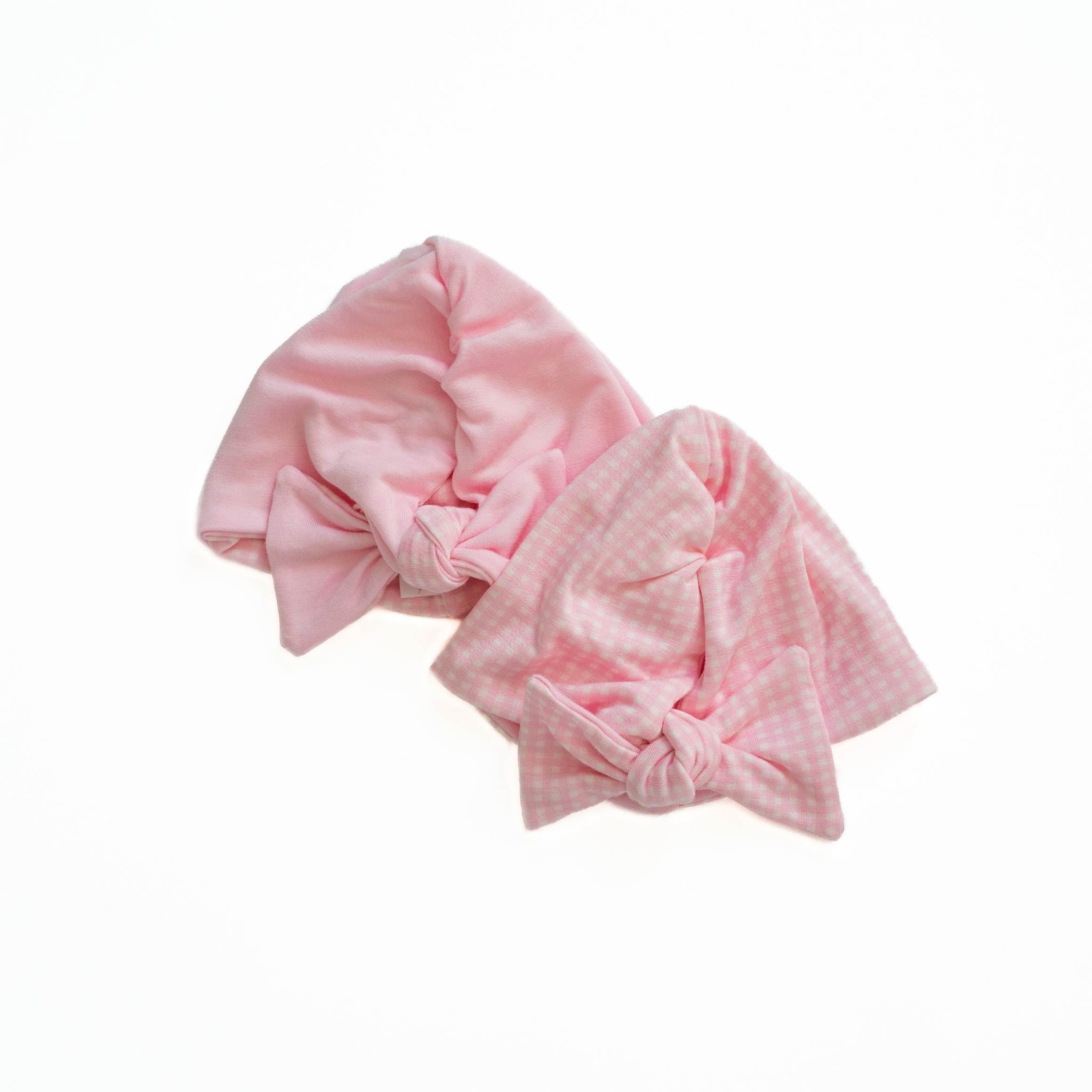 Reversible baby beanie in pink gingham design.
