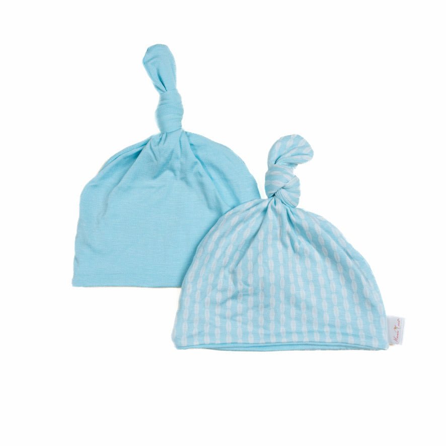 Reversible silky modal baby beanie in lil surfer design.
