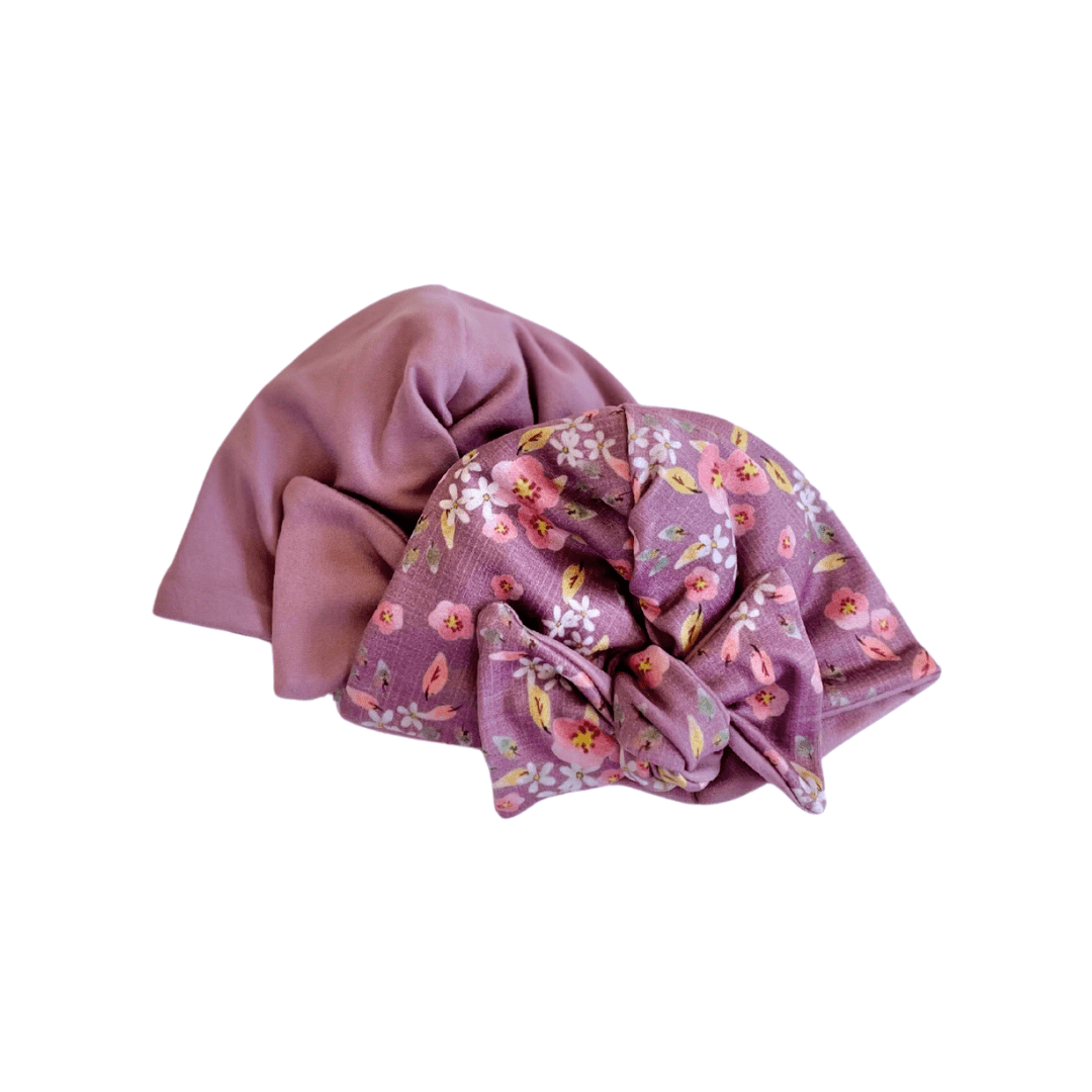 Peachy lilac design reversible baby knotty beanie in classic brushed fabric.