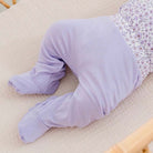 Reversible baby footie pants crafted from a soft silky modal fabric featuring the Purple Posies print.