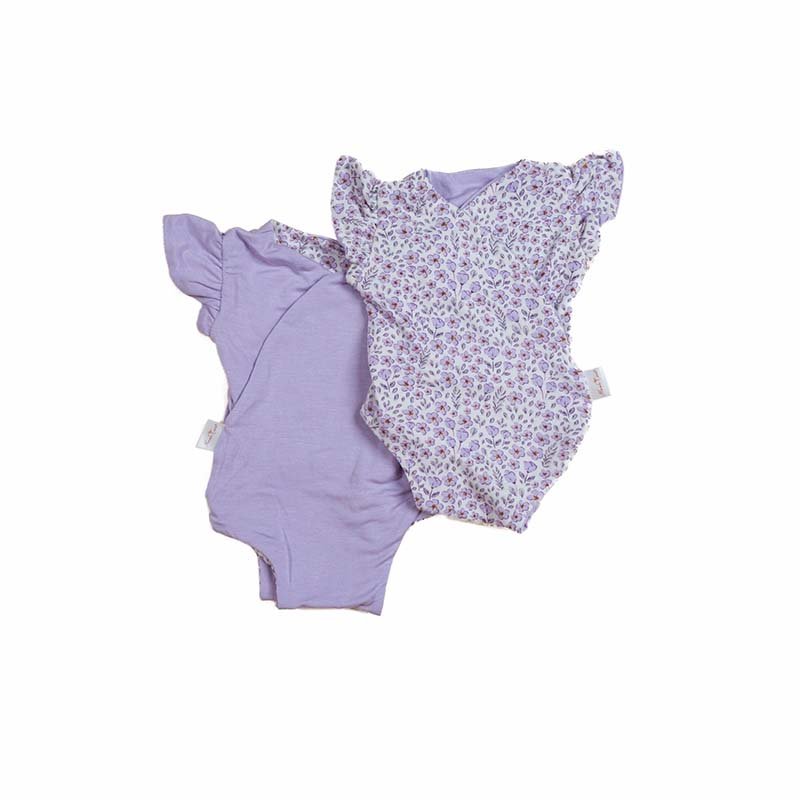 Reversible purple posies design flutter sleeve baby onesie in silky modal fabric.
