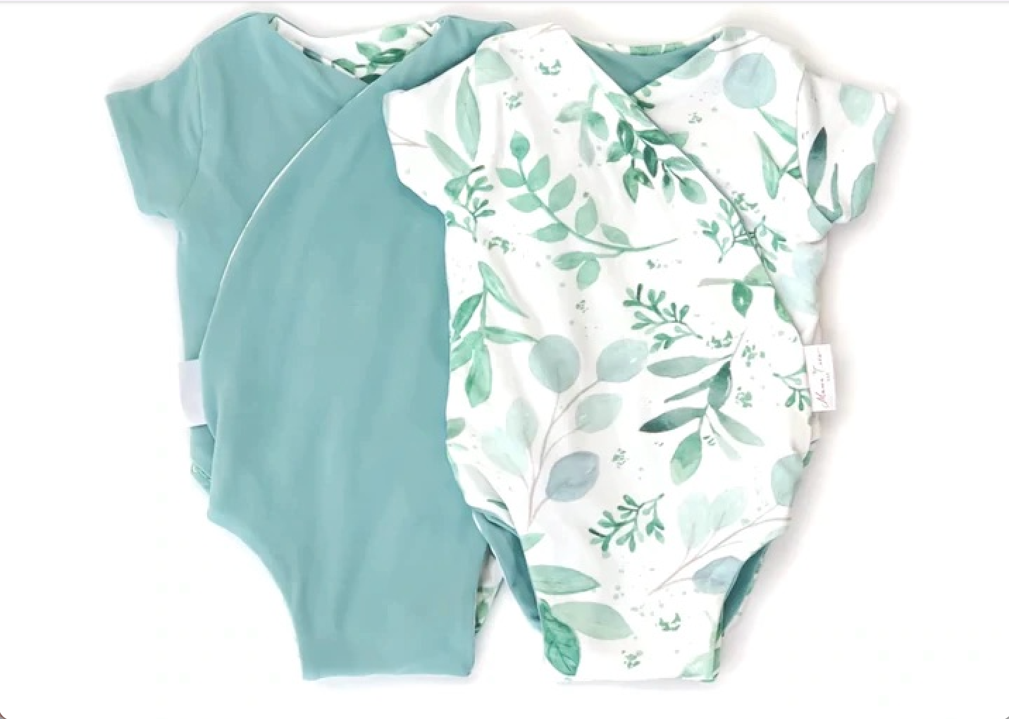 Reversible saged eucalyptus design short-sleeve baby onesie in classic brushed fabric.