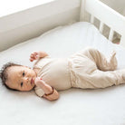 Reversible baby footie pants designed in bamboo cotton fabric featuring our Sandy Sunsets design.