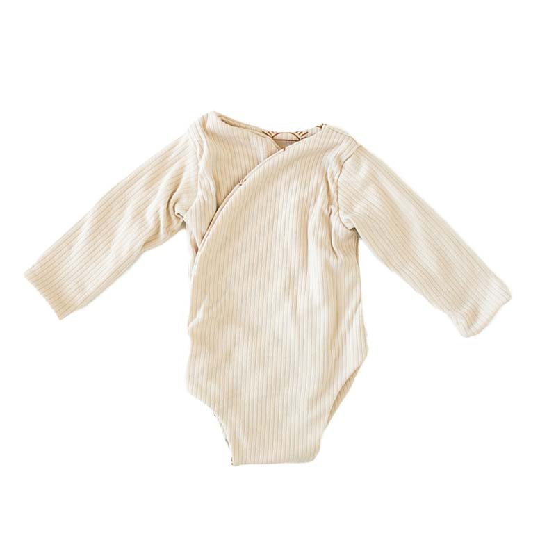 Reversible Sandy Sunsets design long sleeved winged bodysuit in classic brushed fabric.