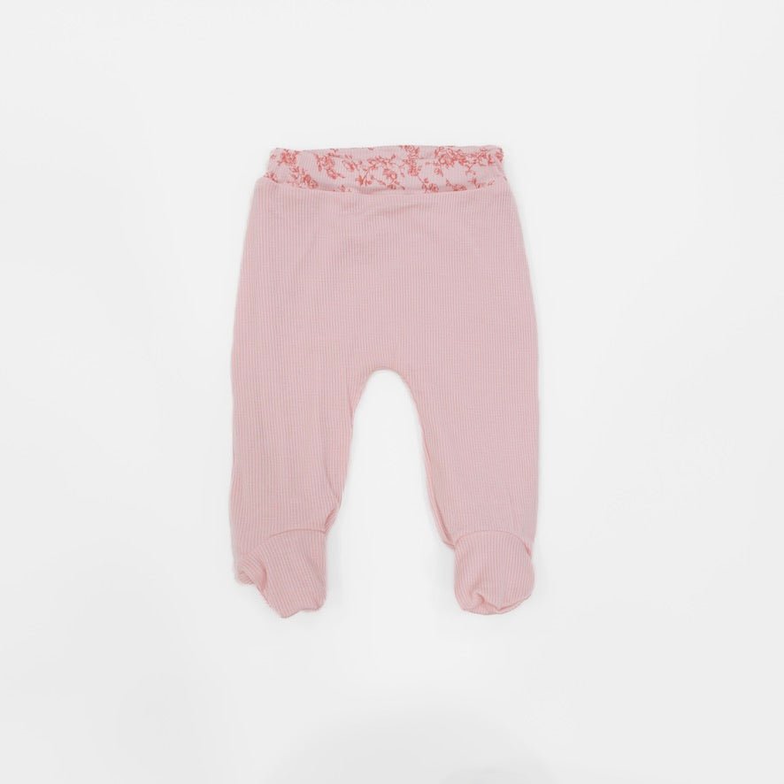 Reversible baby footie pants designed in silky modal fabric featuring our Bitty Pink Blooms design.