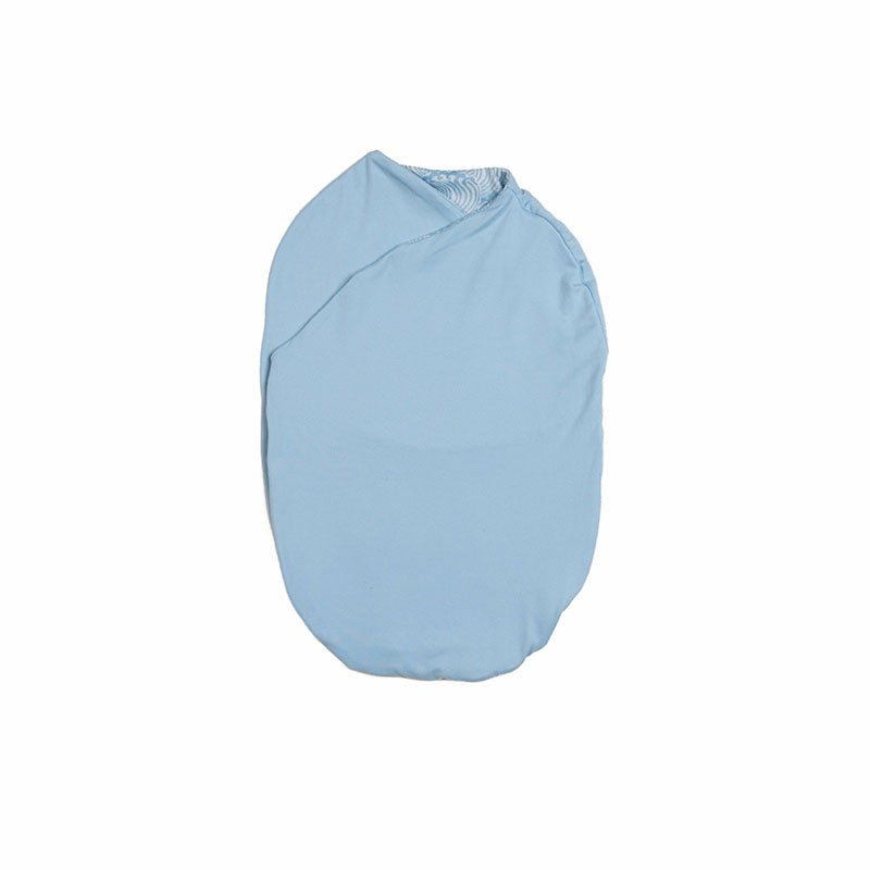 Cozy reversible Silky Modal Blue Swells baby cocoon swaddle for infants.