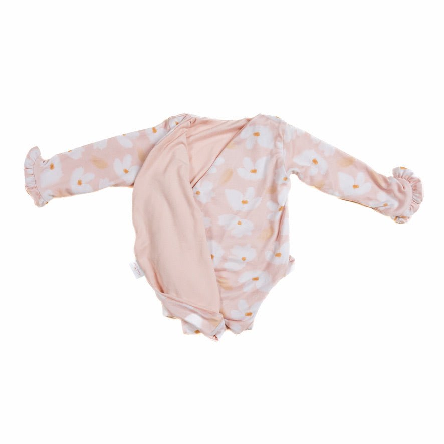 Reversible ruffle cuff long-sleeve onesie in sweet lily design.