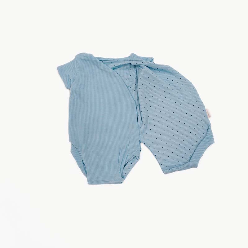 Short sleeved reversible winged bodysuit for babies in silky modal fabric.