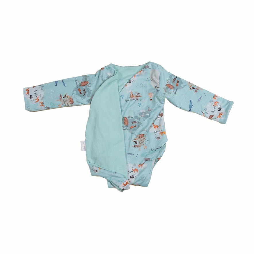 Reversible world traveler design long-sleeve baby onesie in classic brushed fabric.