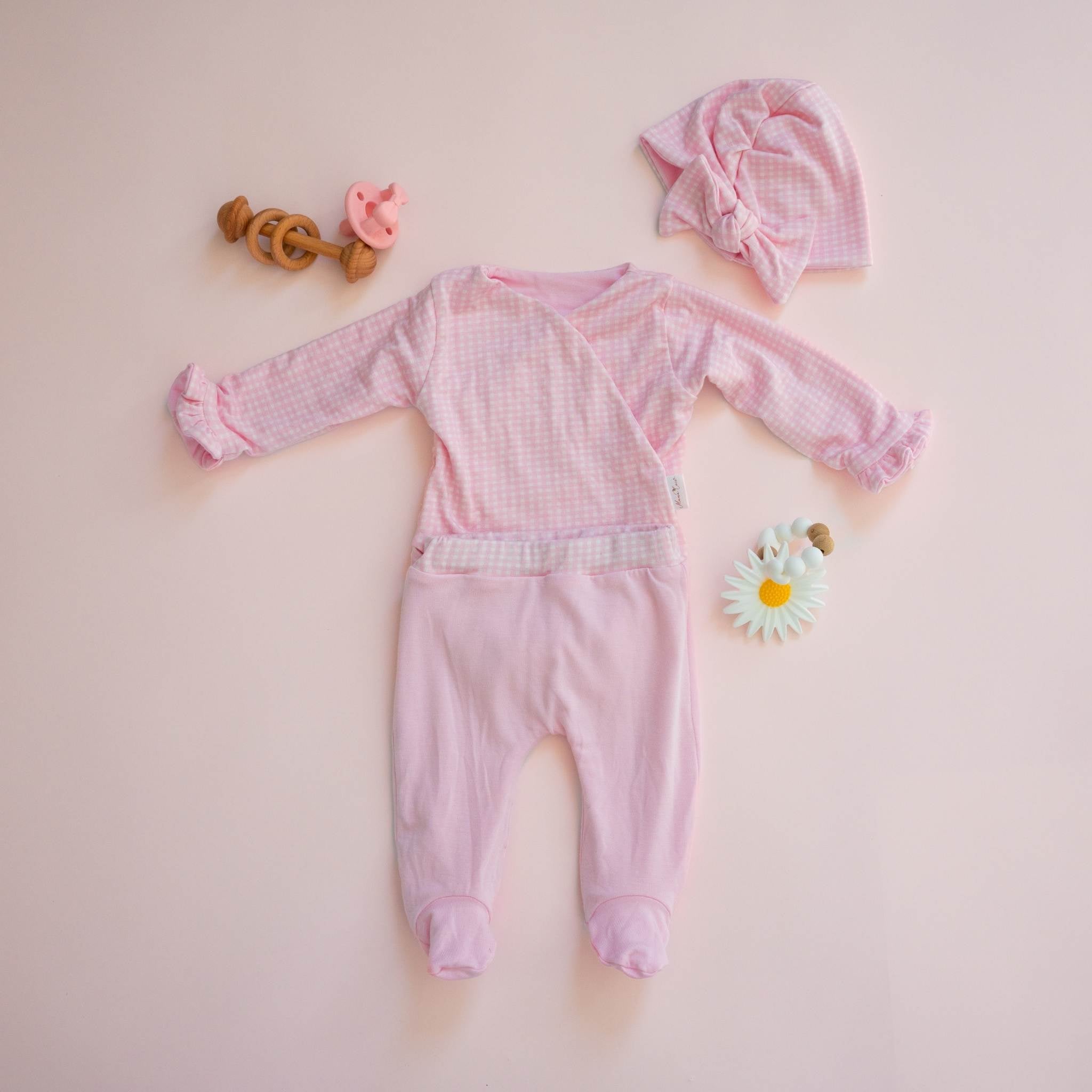 Reversible baby ruffle cuff long sleeve baby onesie outfit bundle made from silky modal fabric in baby pink gingham design.