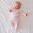 Long-sleeve baby ruffle cuff onesie outfit bundle made from bamboo cotton in dainty dots design.