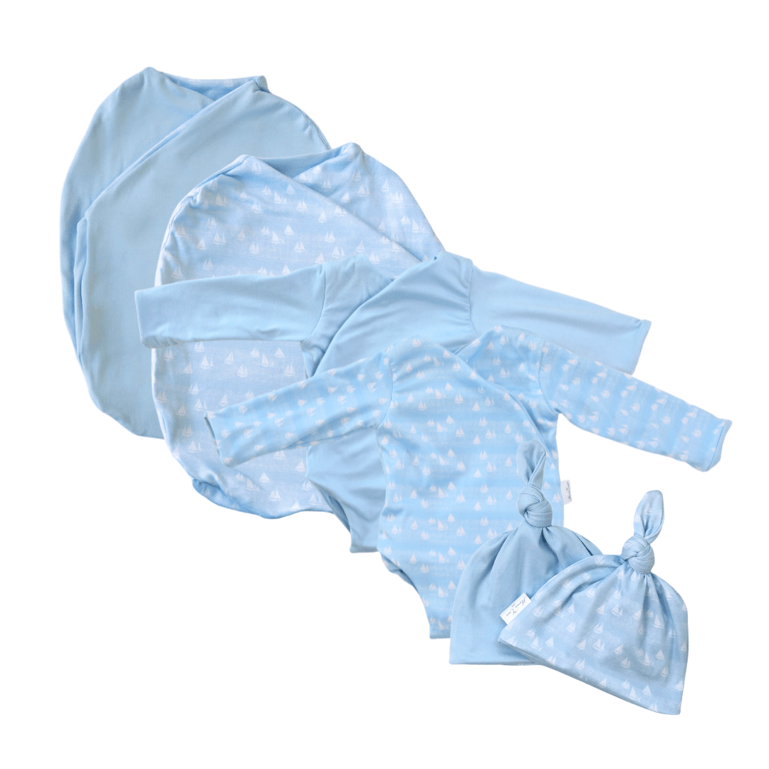 Newborn bundle with long sleeve essentials in classic brushed fabric with sailboat shores design.