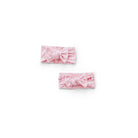 Baby headwraps in whimsical garden design, finished with a matching bow and crafted from bamboo and organic cotton fabric.