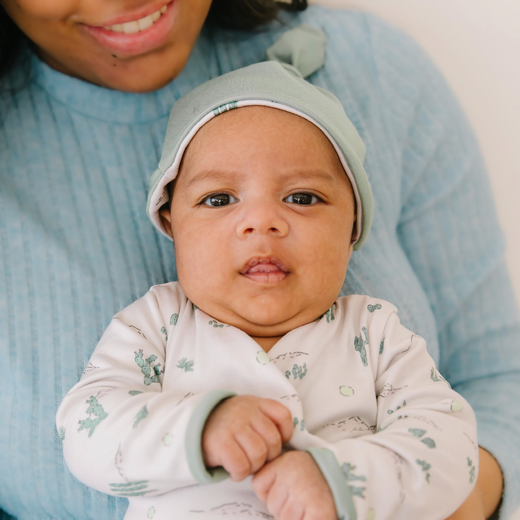 Long-sleeve onesie outfit bundle in desert sunsets design.