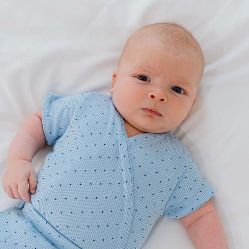 Dotted Blues design short sleeve winged bodysuit.