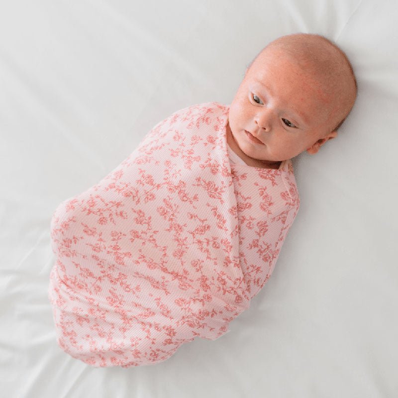 Cocoon swaddle baby blanket in Silky Modal fabric styles with lovely Bitty Pink Blooms details.